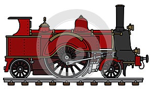 The vintage red steam locomotive