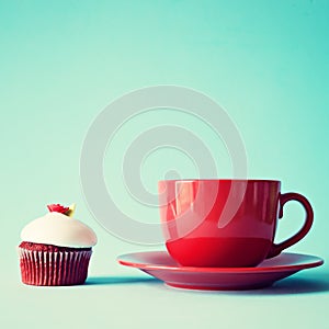 Vintage red tea cup and cupcake