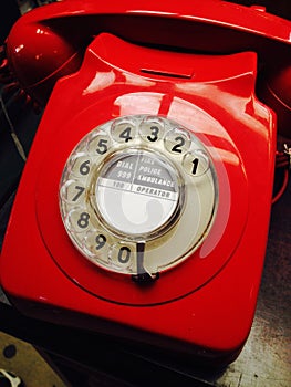 Vintage red telephone with dial