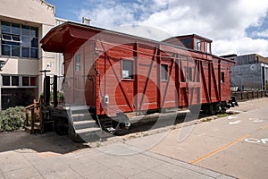 Vintage red train carriage on street at Santa Cruz Beach Boardwalk