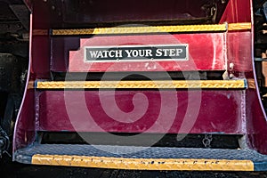 Watch your step sign on train