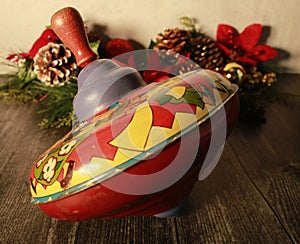 Vintage red and yellow metal spinning top toy,  Christmas