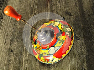 Vintage red and yellow spinning top toy, PRESS and GO