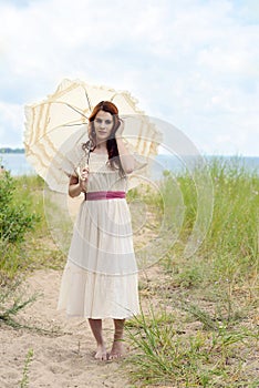 Vintage redhead woman on beach trail