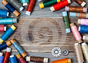 Vintage reels of varicolored thread and old flower buttons