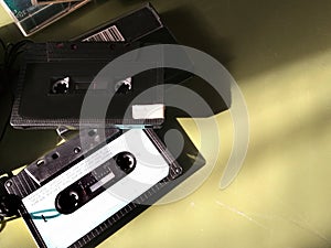 Vintage retro audio compact cassettes, musicasette on a background - nostalgia concept