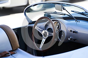 Vintage retro car interior, close-up. Old automobile steering wheel