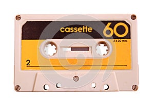 Vintage retro cassette tape on wooden background, gadgets for The 70-80-90`s