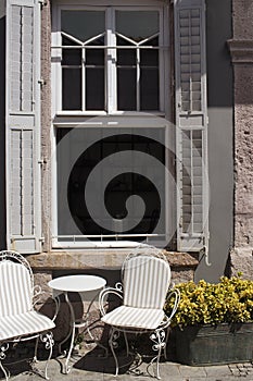 Vintage/retro chairs and table in front of building