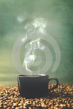 Vintage and retro color tone of warm black cup of coffee on roa