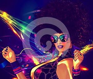 Vintage, retro, disco dancer girl with Afro hair style. Sexy, high energy image for entertainment, clubbing and night life themes