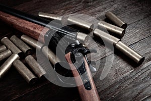Vintage retro double-barreled hunting shotgun with brass cartridges