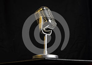 Vintage retro Microphone closeup view with yellow light