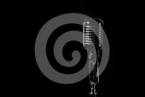 Vintage retro microphone isolated on black