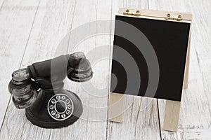 Vintage retro rotary dial phone with chalkboard