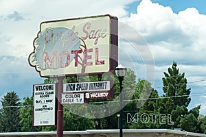 Vintage retro sign for the Purple Sage Motel. Lodging has vacancy. J