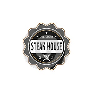 Vintage Retro Steak House Logo Design. With crossed cleavers or knives, and beef or meat icons