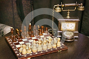 Vintage retro still life with dial phone and chess