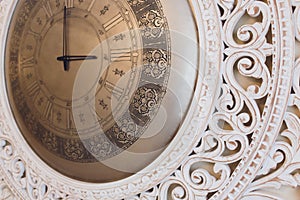 Vintage retro style clock on a wall.