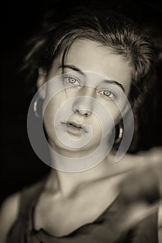 Vintage retro style Print on old paper tones photo headshot of a Beautiful Young Woman