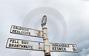 Vintage road sign at Hesket Newmarket in Cumbria