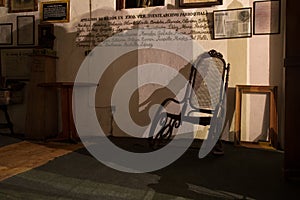 Vintage rocking chair against a wall in Xico, Veracruz, Mexico