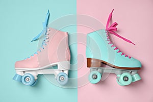Vintage roller skates on color background photo