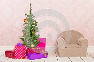 Vintage room with Christmas tree, gifts and chair