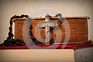 Vintage Rosary Cross on Books