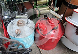 Vintage round galvanized metal gas gasoline fuel canisters.