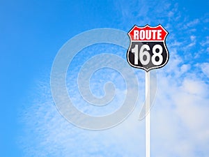 Vintage route 168 road sign and blue sky