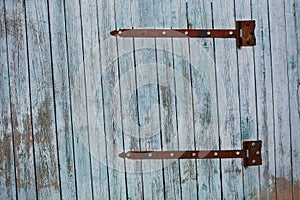 Vintage rural wooden gate with rusted iron elements