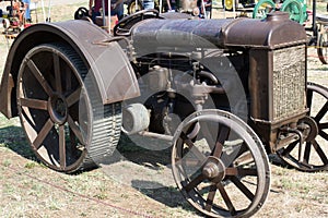 Vintage Rusted Metal Tractor With Unique Wheels