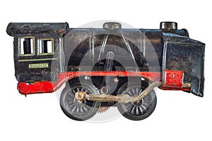 Vintage rusted and weathered black toy train locomotive isolated on white