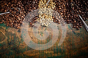 Vintage or rustic border of coffee beans on wood