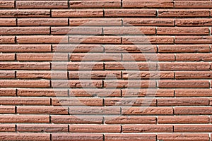 Vintage rustic red color brick wall with a 1/3 offset brickwork pattern