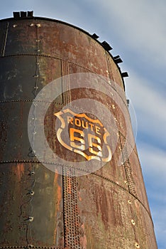 Vintage rusty Route 66 sign painted on metal tank