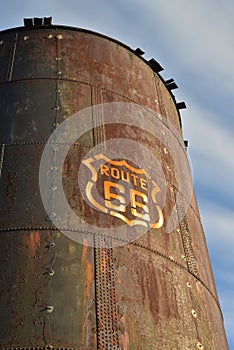 Vintage rusty Route 66 sign painted on metal tank