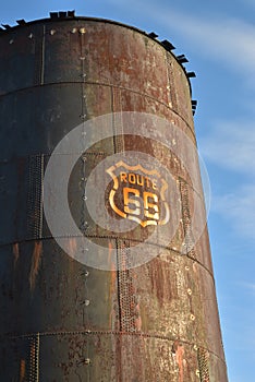 Vintage rusty Route 66 sign painted on metal tank