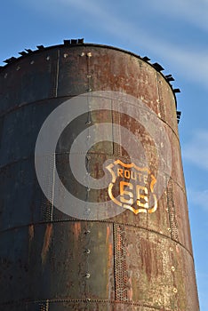 Vintage rusty Route 66 sign painted on metal tank