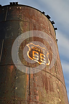 Vintage rusty Route 66 sign painted on metal tank
