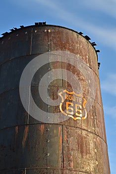 Vintage rusty Route 66 sign painted on metal tank