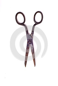 Vintage rusty scissors isolated on white background
