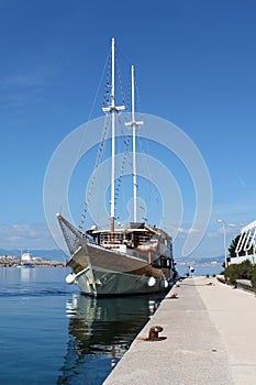 Vintage sailboat docked at local pier