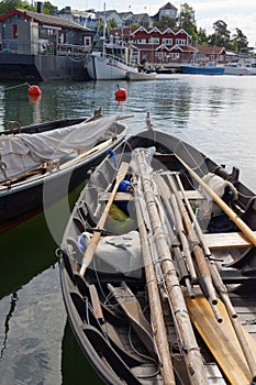 Vintage sailing boats and oars in the harbor