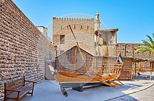The vintage sambuk fishing boat and arish summer house in Al Fahidi Fort, Dubai, UAE