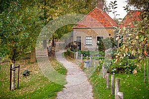 Vintage scene in an old farmers and fishermen`s village in the Netherlands with a backyard.