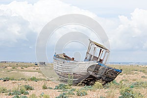 Vintage scene with old worn boats seen ashore