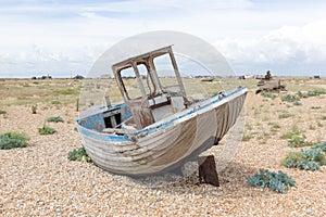 Vintage scene with old worn boats seen ashore