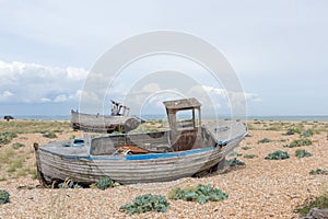 Vintage scene with old worn boats seen ashore